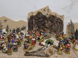 many figurines of people in a nativity setting