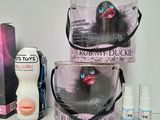 three bags of toiletries and a box of toiletries on a table