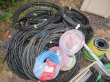 a lot of hoses and other items on the ground