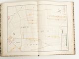an open book with a map of a city on it