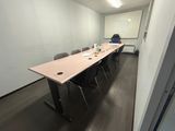 an image of a conference room with a table and chairs