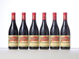 six bottles of red wine lined up in a row