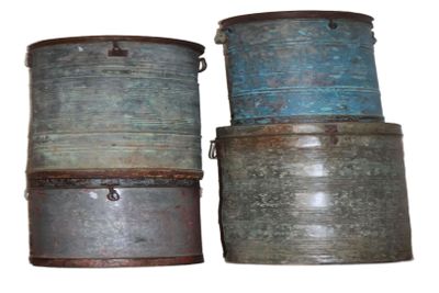 three old metal buckets stacked on top of each other