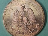 a close up of a coin with an eagle on it