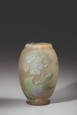 a small vase with a floral design on it