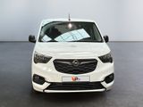 the front view of a white opel parked in a showroom