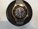a watch that is sitting on top of a black plate