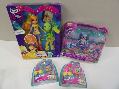 two littlest pet shop toys are sitting on a white surface