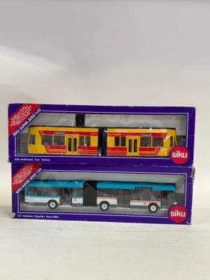 two toy trains that are in the same box