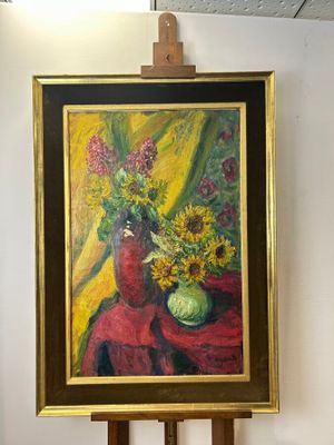 a painting of a vase of flowers on a easel