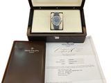 a box with a watch inside of it on a table