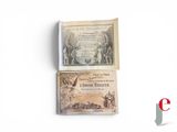 two old bank notes sitting on a white surface