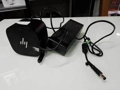 a charger that is sitting on a table next to a charger