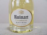 a bottle of wine that is sitting on a table