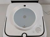 a white electronic device sitting on top of a table