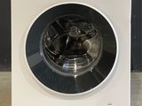 an image of a white washing machine on a counter