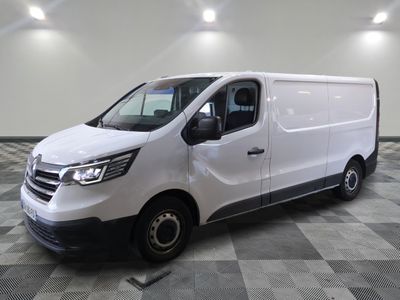the white van is parked on a checkered tile floor