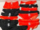 six pairs of underwear are lined up on a table