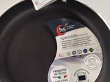 a frying pan on the stove with a label on it