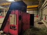 a red machine that is sitting inside of a building