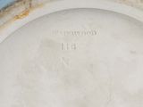 a close up of a white plate with writing on it