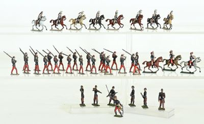 many figurines of soldiers on display in a display case