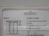 a package of screws in the packaging for a sewing machine