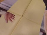 a person holding a piece of paper with a picture of a person ' s hand on it