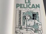 an open book with a drawing of a woman sitting on a bed