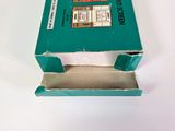 a green box with a red and white label on it