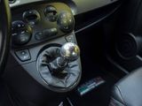 a close up of a car ' s gear lever in the center console