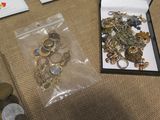 a box full of gold and silver jewelry on a table