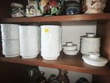 many different types of vases on this shelf