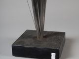 a sculpture of a plant that is on top of a box