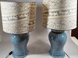 two lamps that are sitting on a table