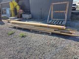 a pile of wood sitting in front of a building