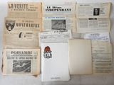 a lot of old newspapers that are on the table