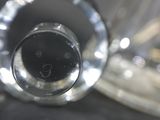 a close up view of a glass vase with a face on it