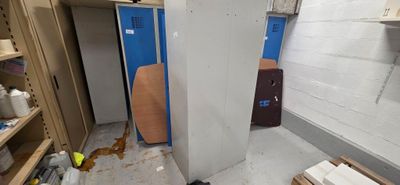 an image of a room that has a refrigerator in it