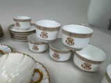 a lot of cups and saucers on the table