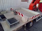 an image of a flatbed truck with a crane in the back