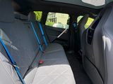 the back seats of a car with the sunroof down and the back seats folded down
