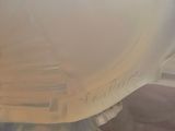 a close up of a plastic bowl on a table