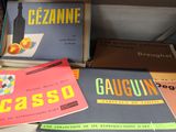 many books that are sitting on top of a table