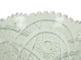 a clear glass bowl with a decorative design on it