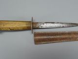 two knives that are sitting next to each other on a table