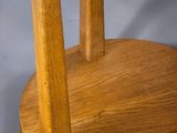 a wooden stand with two candles on top of it