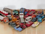 a lot of toy trucks that are sitting on the floor