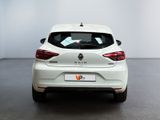 the rear end of a white car in a white room