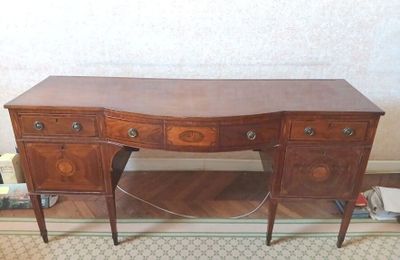 une image représentant un bureau avec un plateau en bois et deux tiroirs